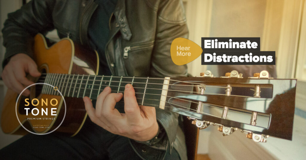 Facebook post built on the headline Eliminate Distractions over a moody guitar image.