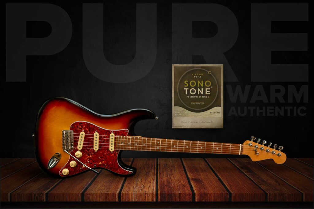 Sunburst Stratocaster beside a SonoTone Vintage string pack on rustic wood, Pure / Warm / Authentic set behind.