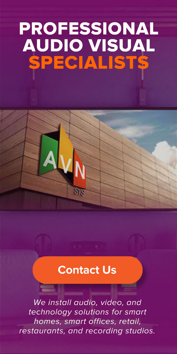 AVN | SYS 'Professional Audio Visual Specialists' display ad promoting audio, video, and technology installation for smart homes, offices, retail, restaurants, and recording studios, with the geometric AVN logo on a purple backdrop.