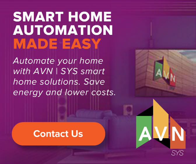 AVN | SYS 'Smart Home Automation Made Easy' display ad promoting whole-home automation that saves energy and lowers costs, on a purple living-room backdrop with a wall display and the AVN logo.