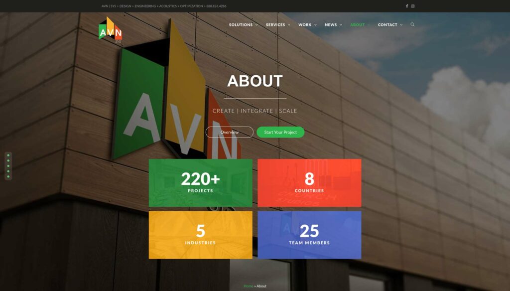 AVN | SYS website About page with a 3D AVN logo on a building exterior, the Create | Integrate | Scale line, and stat tiles for 220+ projects, 8 countries, 5 industries, and 25 team members.