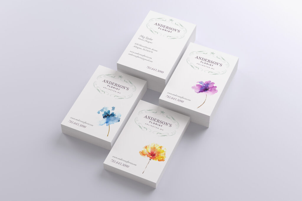 Four white card comps with delicate watercolor blooms in purple, blue, and orange beneath airy wreathed lettering, exploring a soft botanical direction.