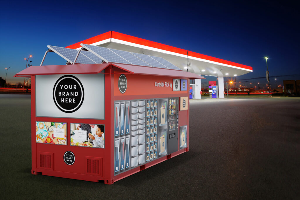 Red CX20 unit rendered at dusk beside an illuminated gas station canopy, solar panels and stocked lockers glowing under the evening lights.