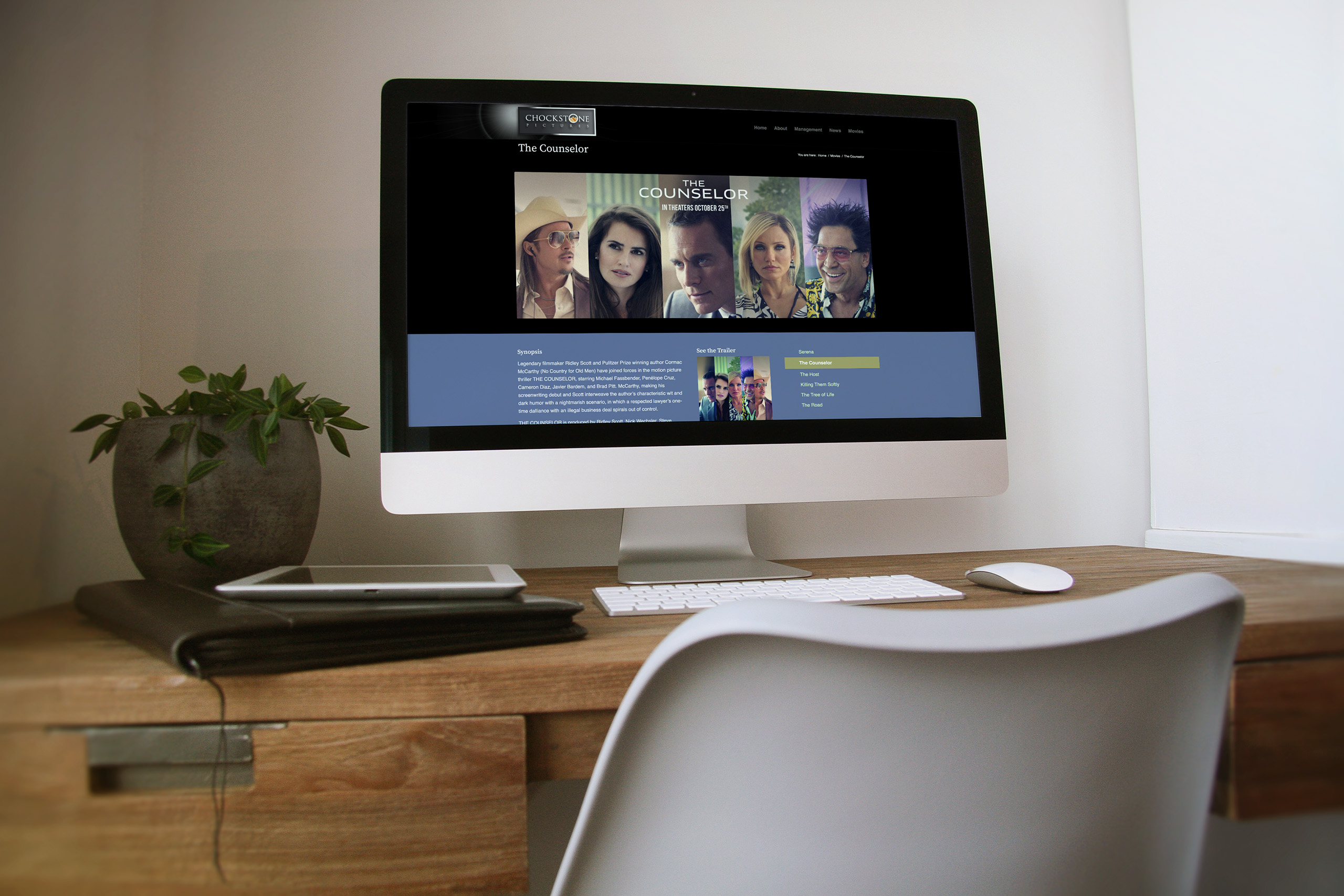 The Counselor film page on an iMac, the cast banner above synopsis, trailer stills, and reviews framed by the film’s own artwork.