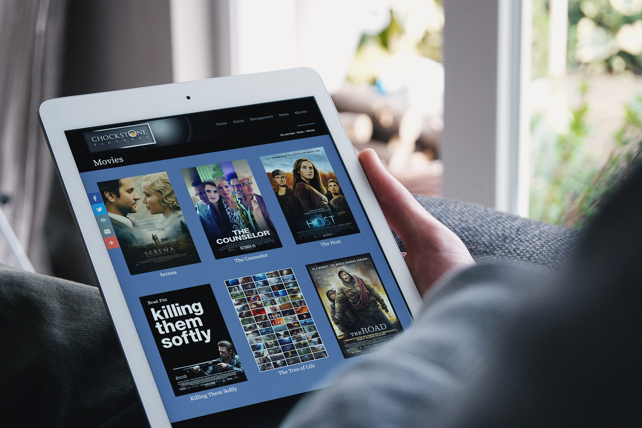 Movies page on an iPad, the slate presented as poster cards from Serena and The Counselor to Killing Them Softly, The Tree of Life, and The Road.