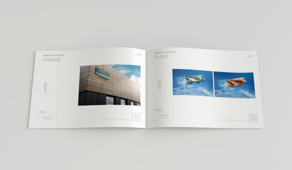 Style guide spread presenting the exterior signage application beside the wordmark and monogram flags photographed against blue sky.