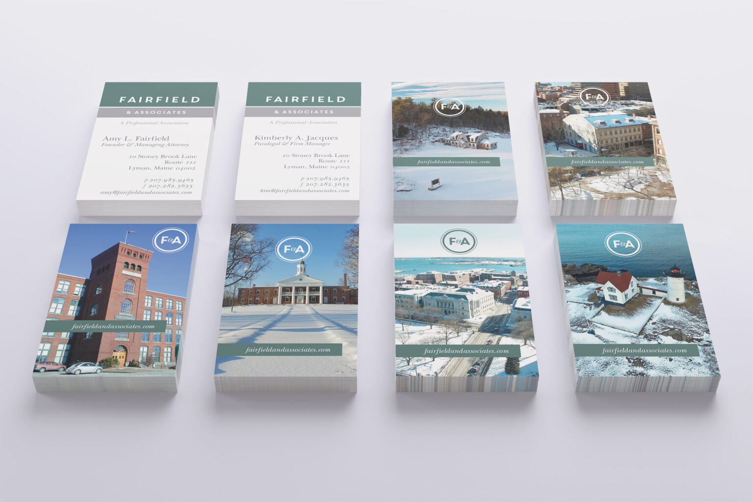 Eight stacks of Fairfield & Associates business cards, attorney card fronts alongside photographic backs of Maine landmarks, each sealed with the F&A monogram.