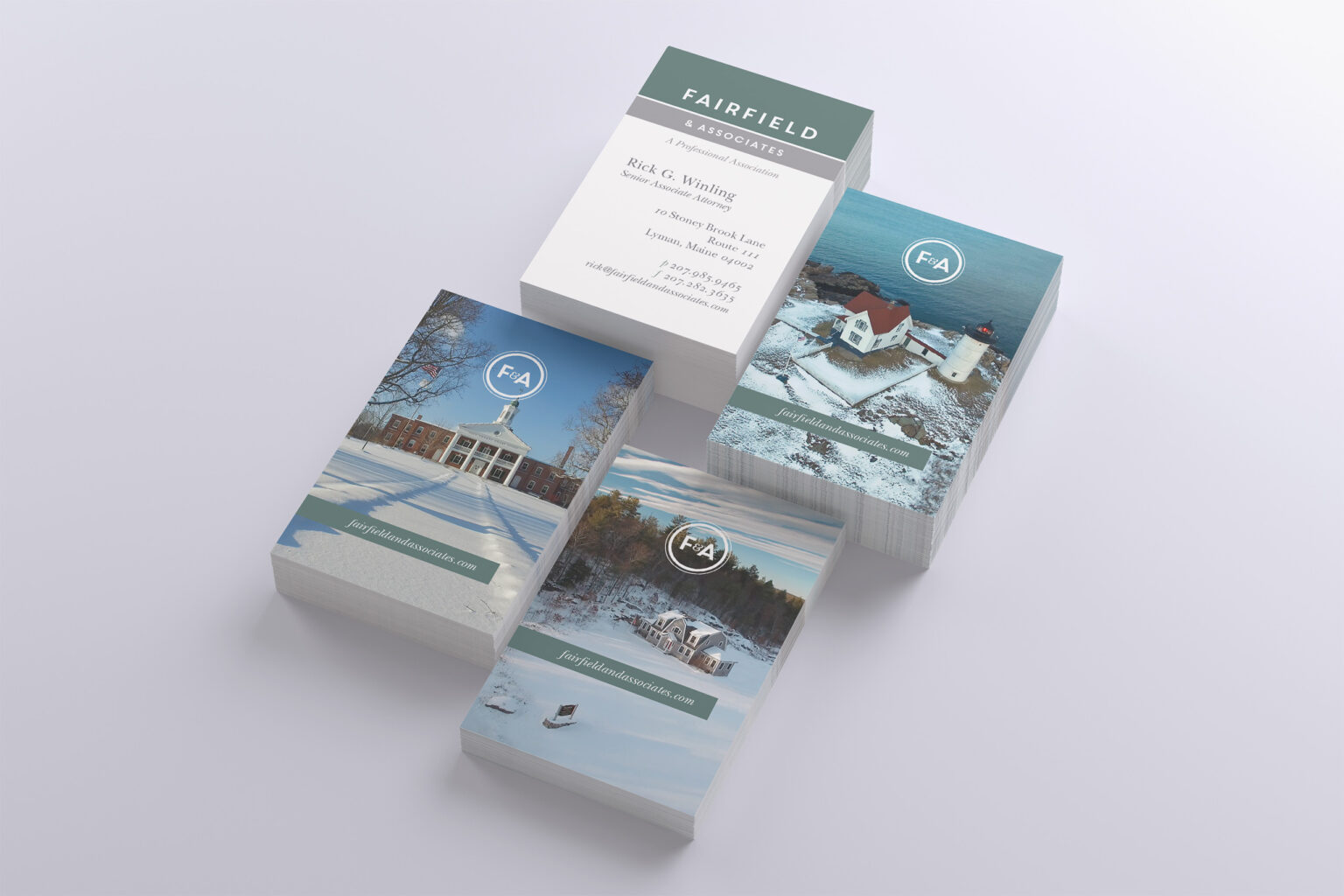 Four stacks of business cards pairing an attorney card front with F&A-sealed photo backs of the courthouse, Nubble Light, and wintry Maine coast.