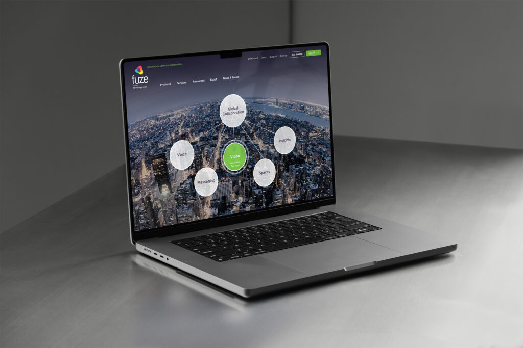 Fuze global homepage on a MacBook, collaboration bubbles for voice, video, messaging, and insights orbiting over aerial Manhattan.