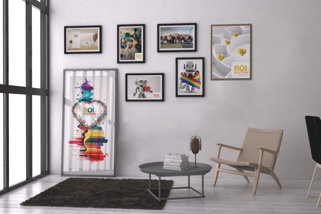 Virtual meeting backdrop of a sunlit lounge with a gallery wall of framed brand prints around a rainbow heart poster.