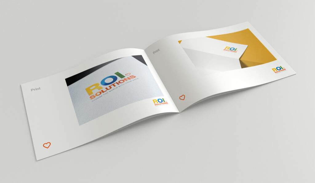 Spread from the print section with the logotype on textured paper beside a gold envelope and stationery detail.