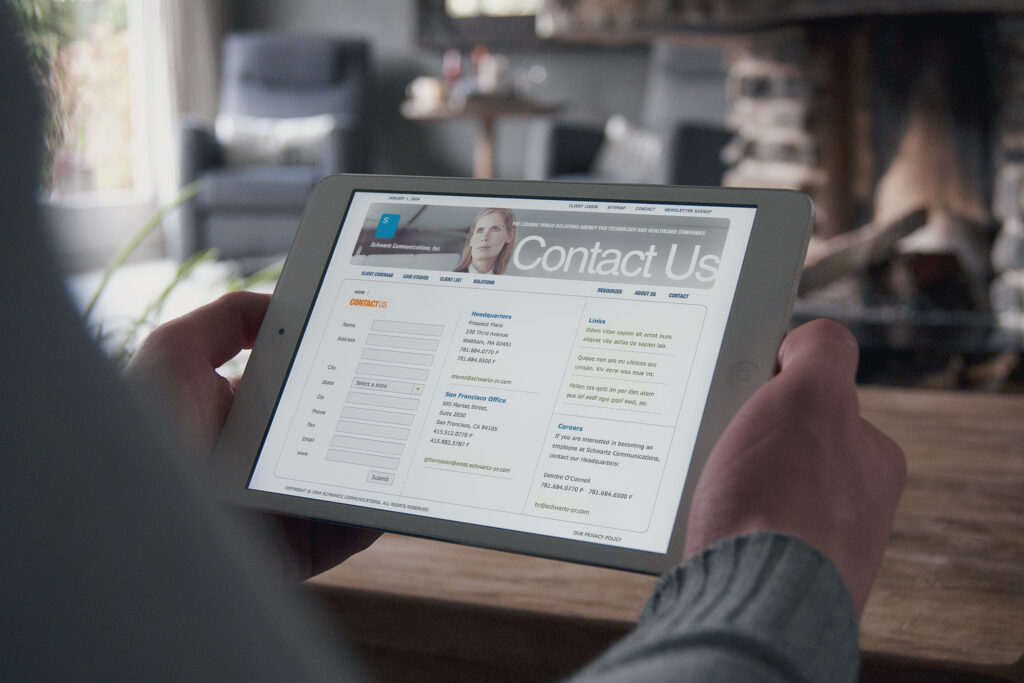 Contact Us page on an iPad, headquarters and San Francisco office details beside the inquiry form and careers note.