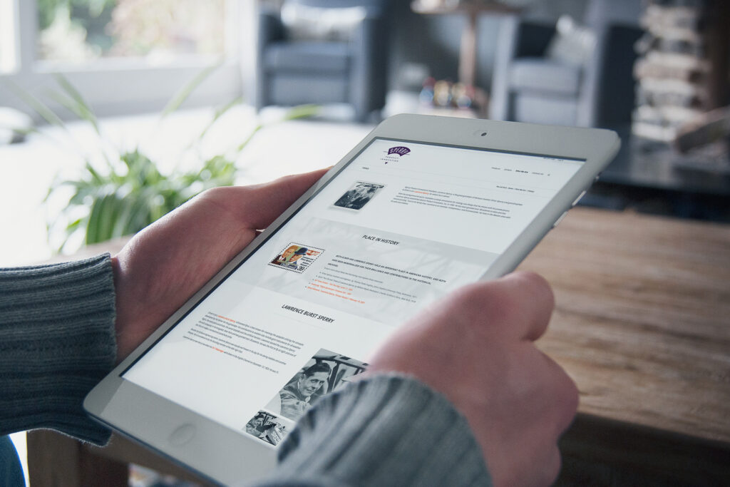 History page on an iPad mini tracing the Sperry legacy, archival portraits and a Place in History timeline of Lawrence Burst Sperry.