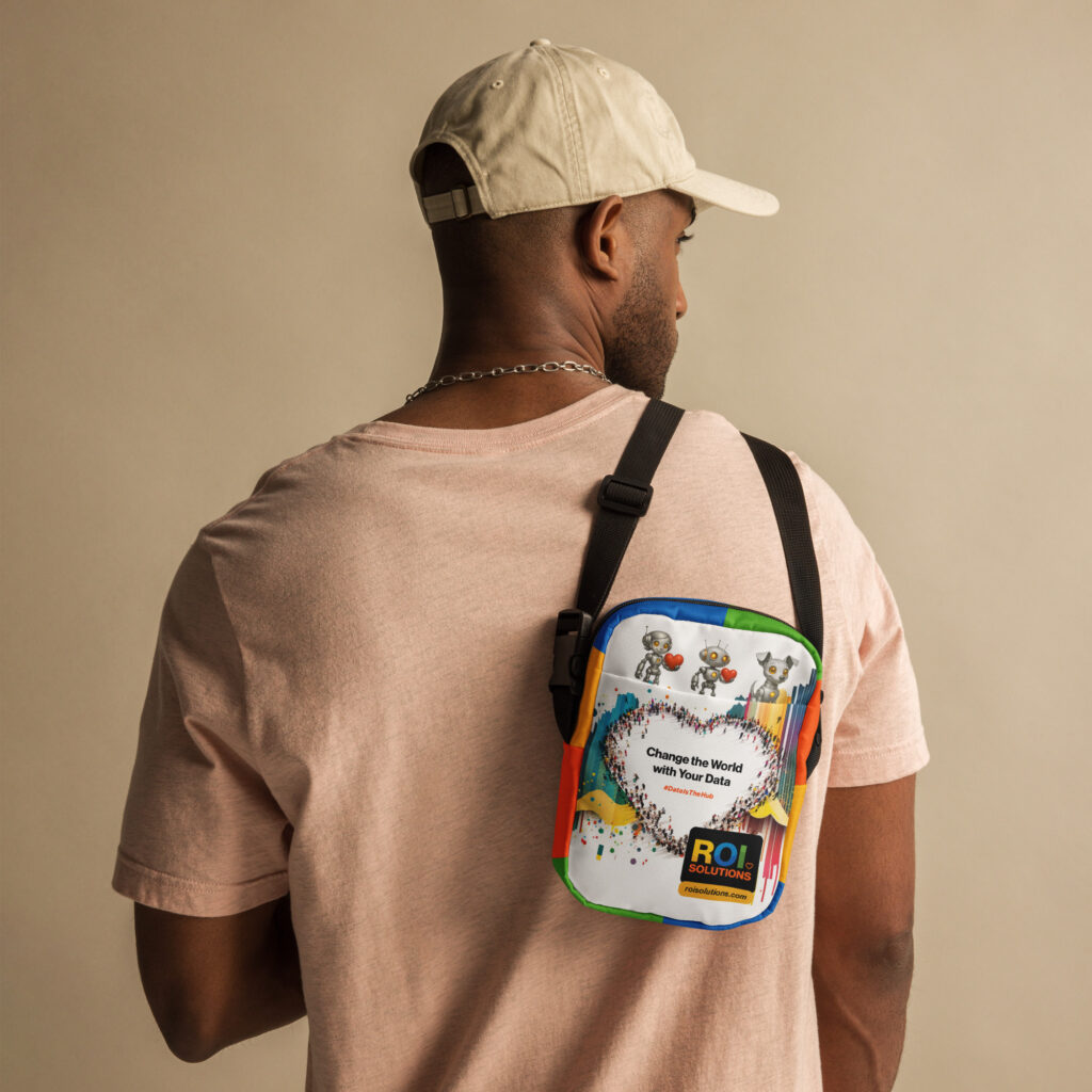 Model in a cream cap wears the utility crossbody on his back, characters and crowd heart facing out.