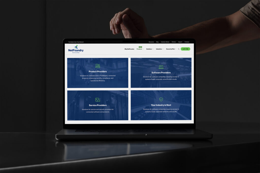 Hands reach over a laptop showing the four industry tiles from product providers to your industry is next.