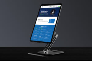 Stand-mounted tablet showing the NetFoundry Platform page, the overview panel above the blue capability grid.