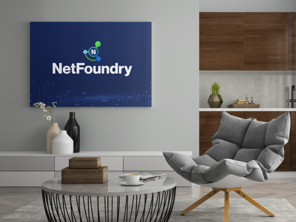 Virtual meeting backdrop of a gray reading corner, the reversed logo on a navy skyline canvas above the credenza.