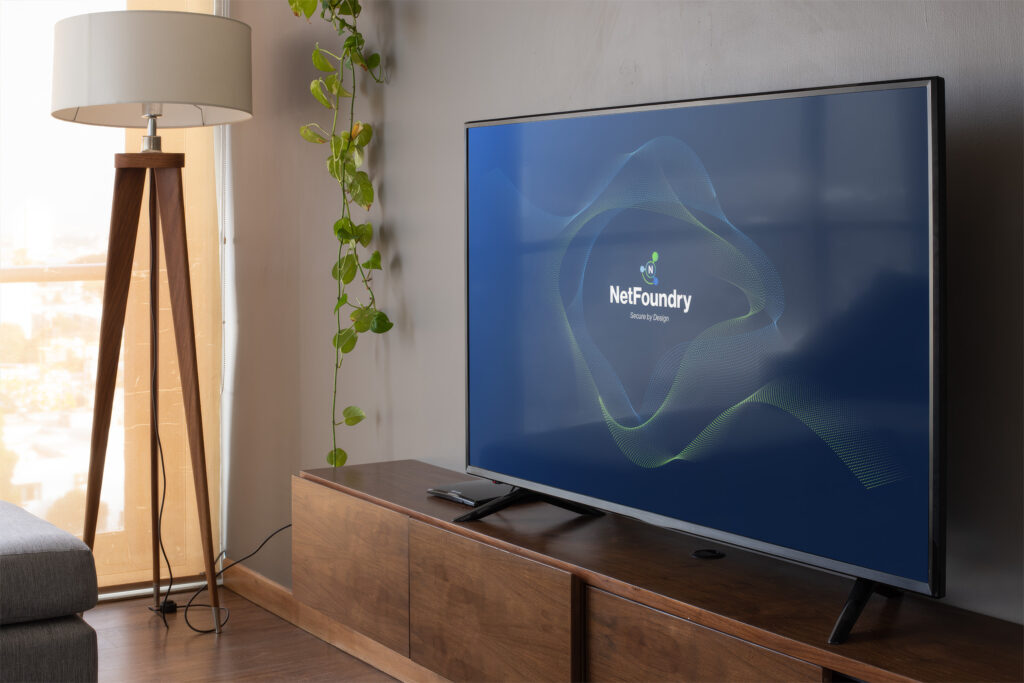 Virtual meeting backdrop of a warm wood living room, the wave-lines brand screen glowing on the television.