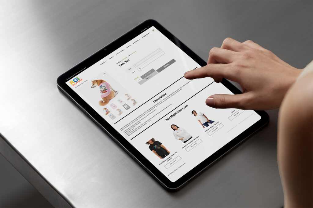 Hand taps the pet tank product page on a tablet, the Shiba model above related products.