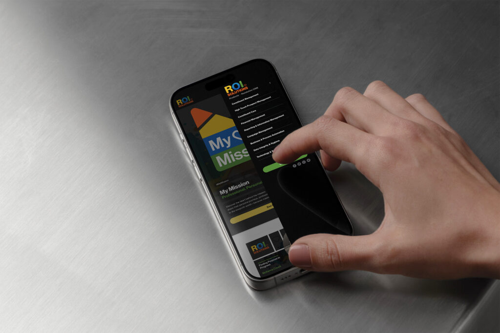 Thumb opens the dynamic mobile menu over the My Mission tile, role and mission links stacking on the dark sheet.