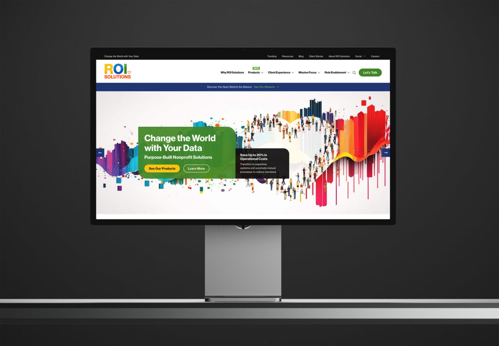 Studio display showing the homepage hero, Change the World with Your Data on green beside the crowd heart and paint streaks.