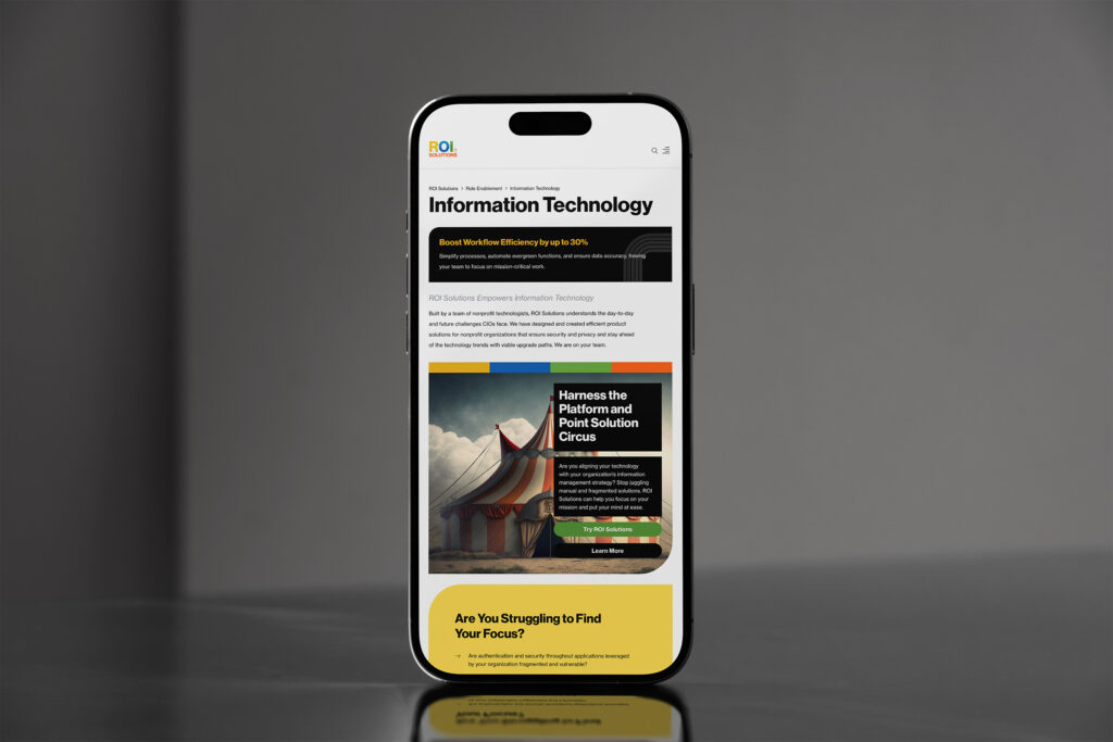 Phone standing on steel showing the Information Technology page, a circus-tent panel asking about platform and point solutions.