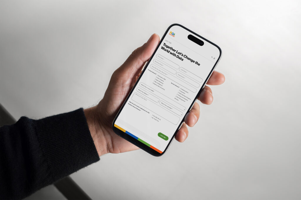 Hand holds a phone showing the Lets Talk contact form under Together Lets Change the World with Data.