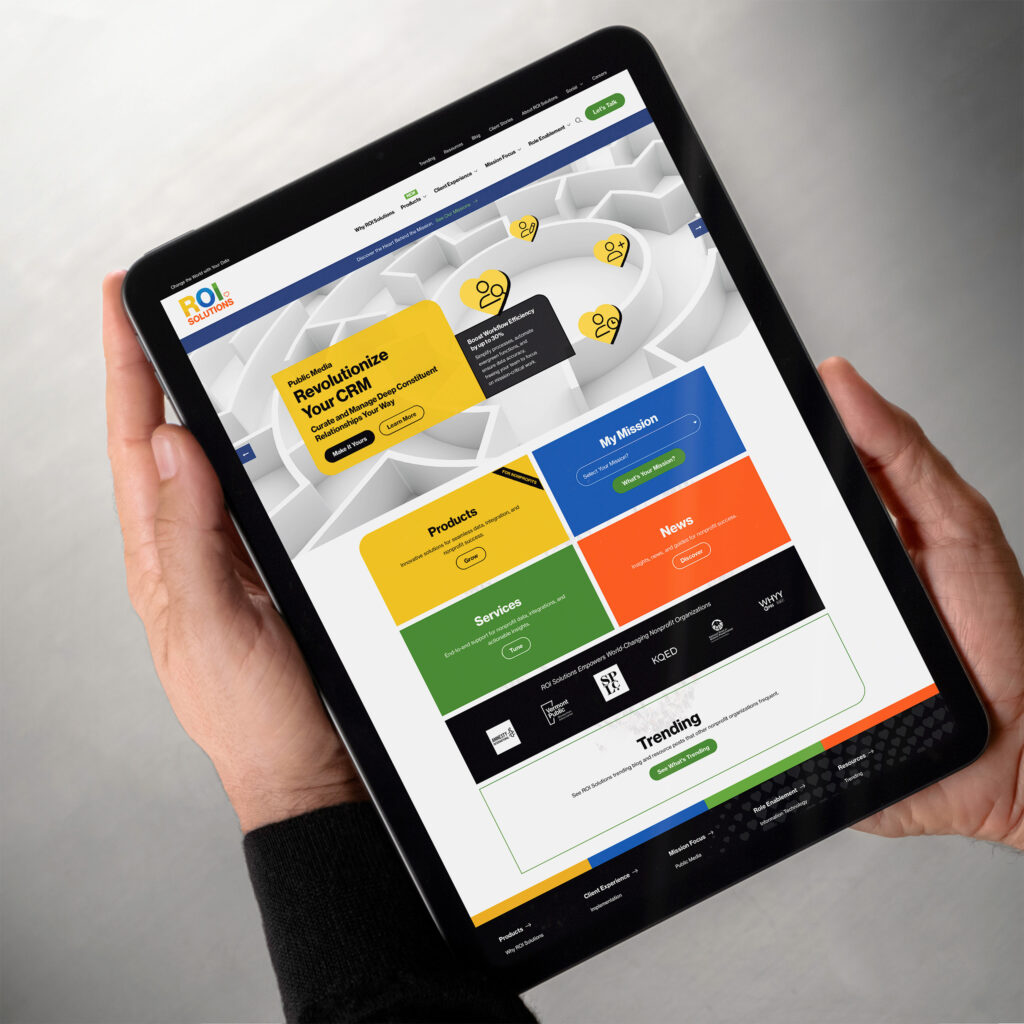 Hands hold a tablet with the homepage personalized for public media, Revolutionize Your CRM hero above station logos.