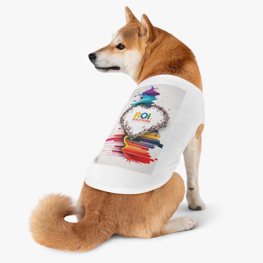 Shiba Inu glancing back in the white pet tank, the crowd heart print across its back.