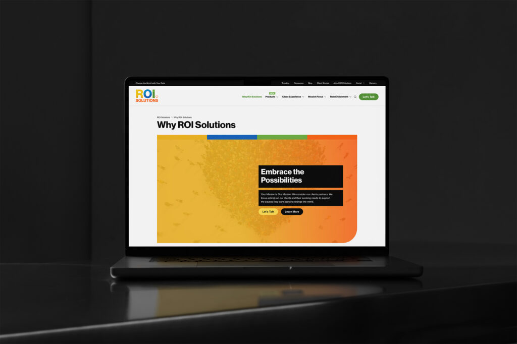 Laptop showing the Why ROI Solutions page, an Embrace the Possibilities panel over the gold and orange crowd artwork.