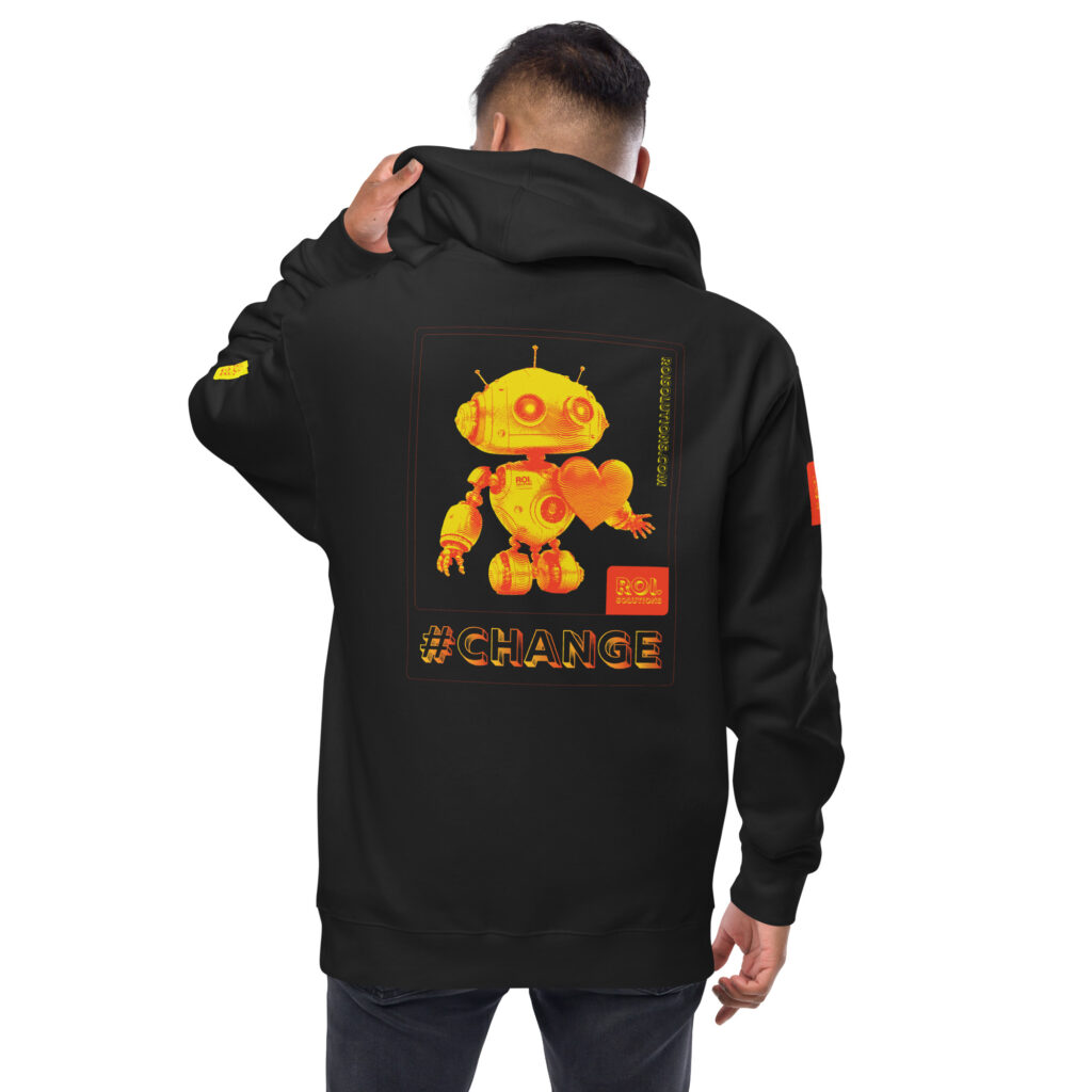 Model glances over his shoulder in the black fleece hoodie, the gold Change robot and hashtag Change printed across the back.