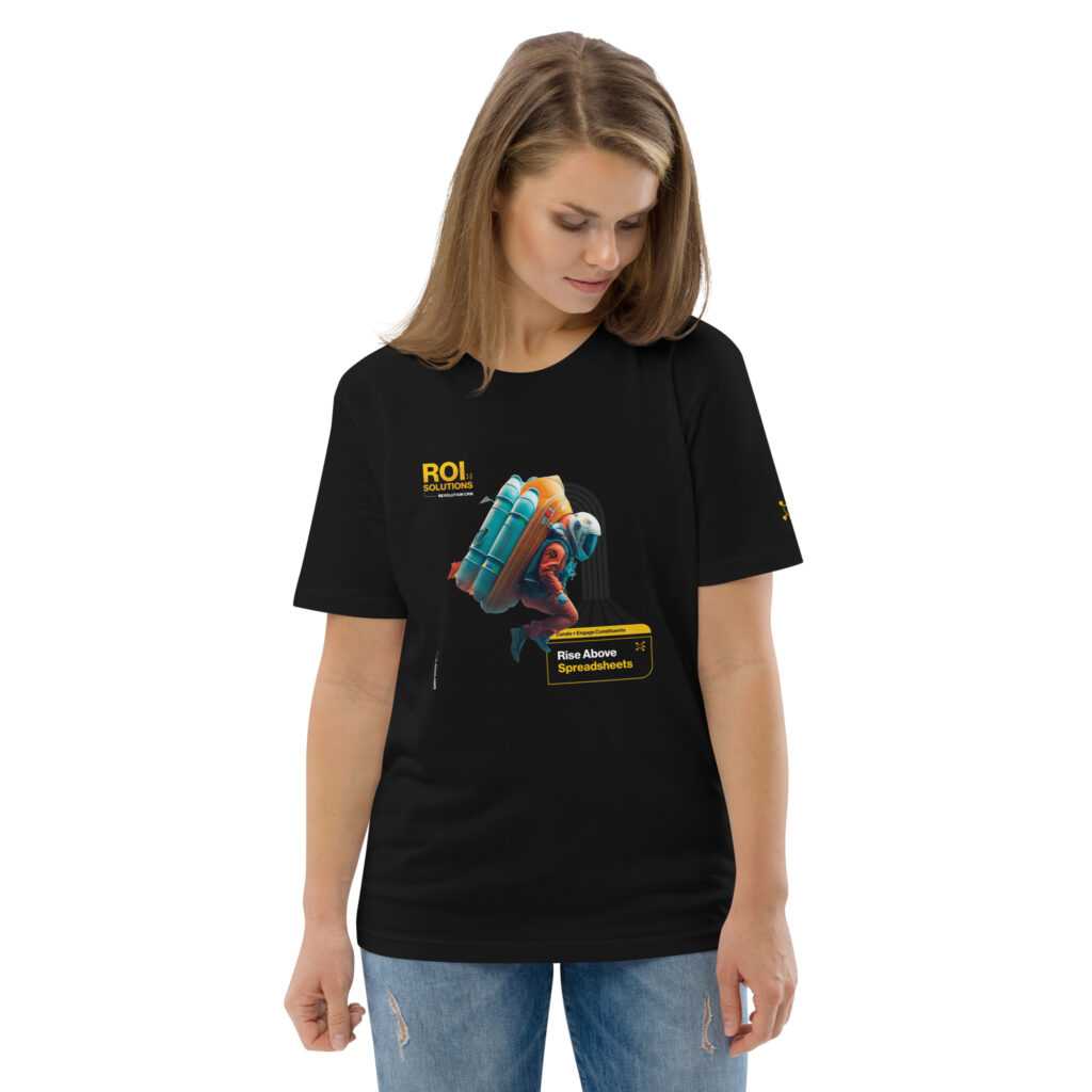 Model looks down at the black organic cotton tee, the rocket-pack explorer and Rise Above Spreadsheets print.