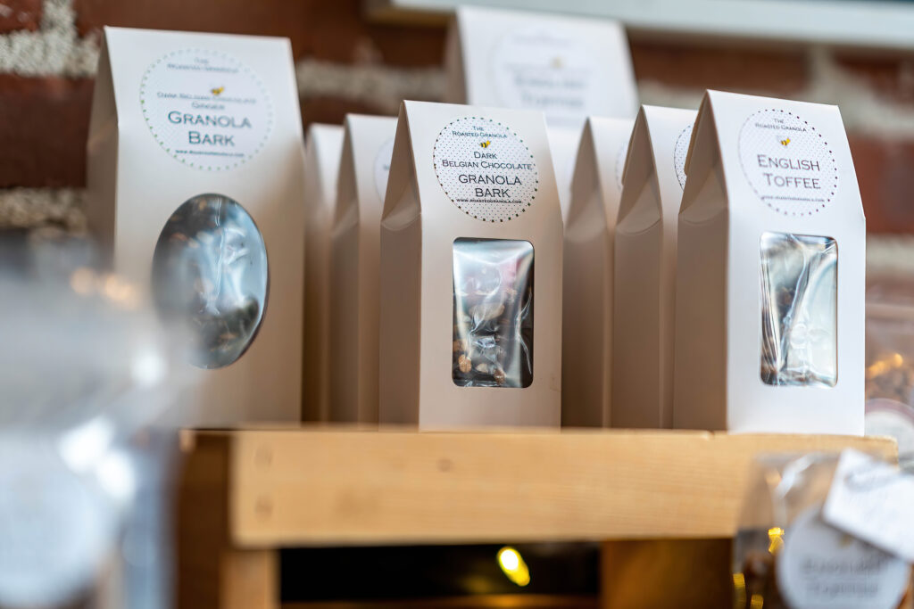 Boxes of Granola Bark, Dark Belgian Chocolate Granola Bark and English Toffee from The Roasted Granola.