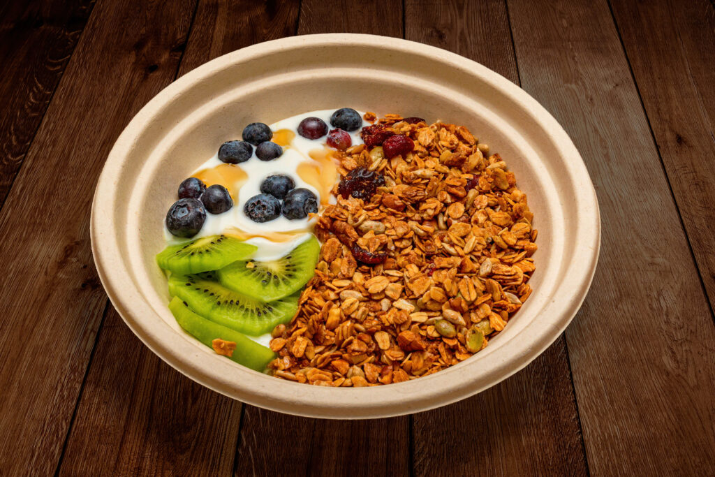 Granola bowl with yogurt, blueberries, dried cranberries and kiwi from The Roasted Granola.